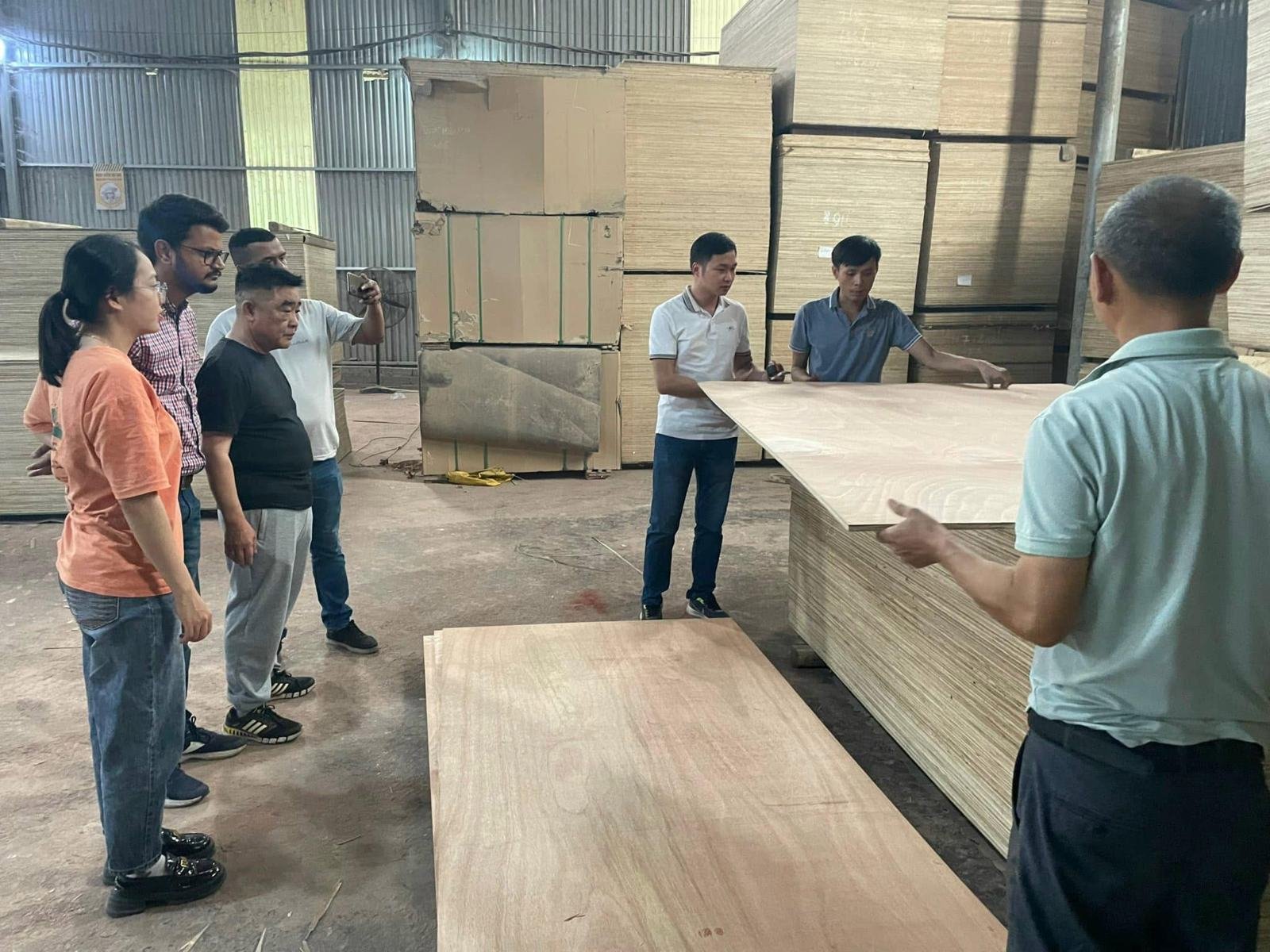 Buyers inspecting panels at the factory